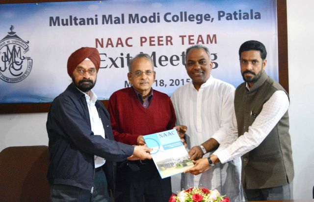 NAAC Peer Team Presenting Re-accreditation Report to College Pri